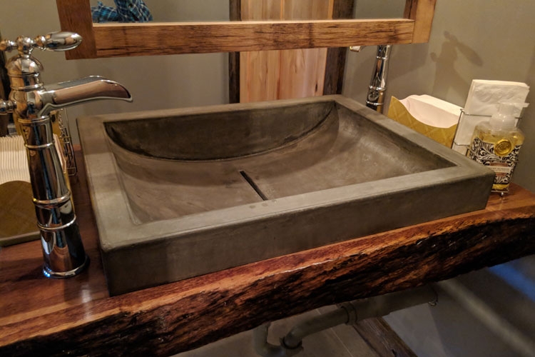 Upstairs Restroom: Custom concrete sink with Live-edge vanity